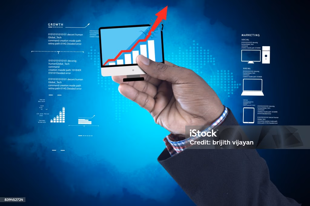 Hand drawing and upward red line on a digital bar graph, surrounded by charts, pie diagrams, and data icons- symbolizing businesses growth ,analytics, and financial forecasting.